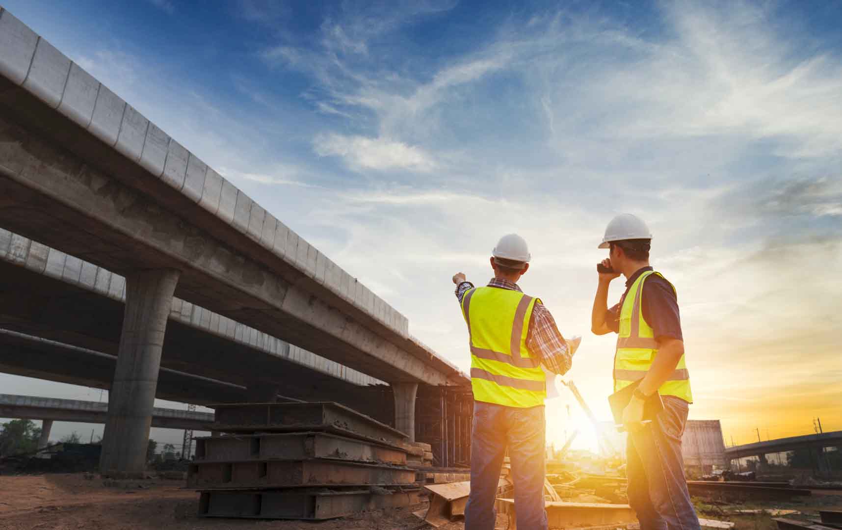 Asian,Architect,And,Mature,Supervisors,Meeting,At,Construction,Site,Multiethnic